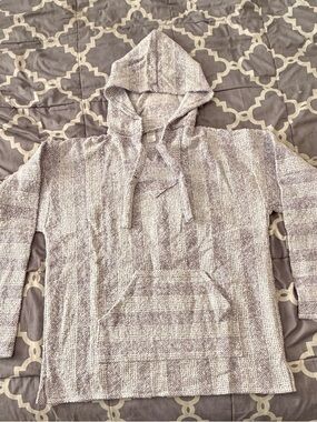 Baja hoodie, also known as a "drug rug" or "Mexican pullover Lavender and white